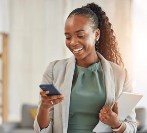 Business owner reviewing an order on her phone